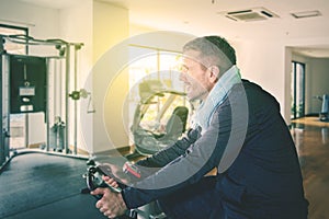Caucasian man doing workout with gym cycling