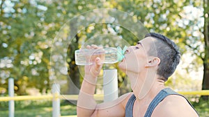 Caucasian Man Drinking Water After Exercises