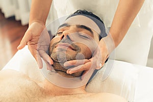 Caucasian man enjoying relaxing anti-stress head massage. Quiescent