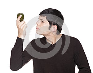 Caucasian man examining a lime