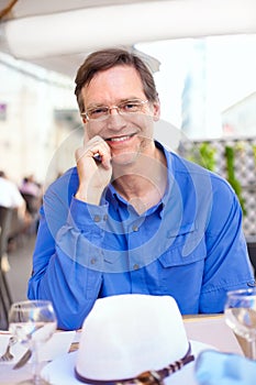 Caucasian man in fifties at outdoor restaurant in Italy