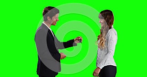 Caucasian man giving car keys to the lessor with green screen