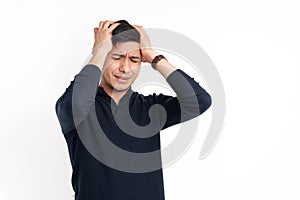 Caucasian man with his hands on the head with pain gesture isolated on a white background