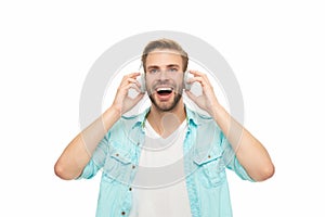 Caucasian man isolated on white. Student guy listen audio. Millennial man listen to music in headphones. Music concept