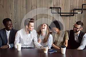 Caucasian man joking at cafe meeting making multiracial friends