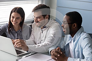 Caucasian man led meeting showing to diverse interns corporate app