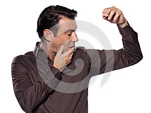 Caucasian man looking at sweat stain perspiring