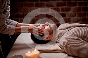 Caucasian man lying on massage table and relx