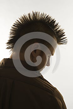 Caucasian man with mohawk.