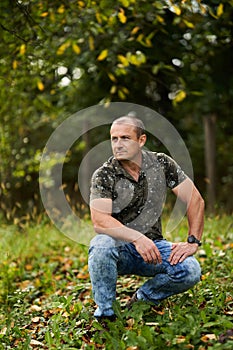 Caucasian man portrait in an orchard