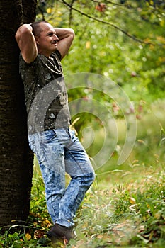 Caucasian man portrait in an orchard