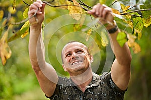 Caucasian man portrait in an orchard
