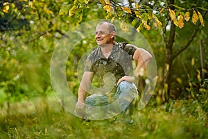 Caucasian man portrait in an orchard