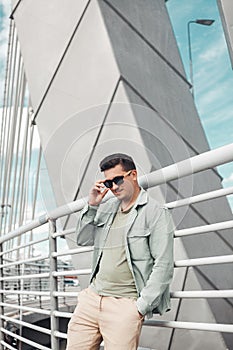Caucasian man portrait white young stylish hairstyle in sunglasses.