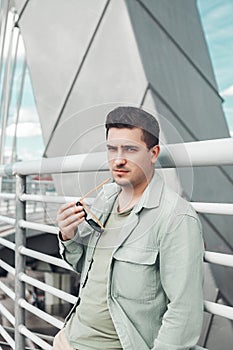 Caucasian man portrait white young stylish hairstyle in sunglasses.