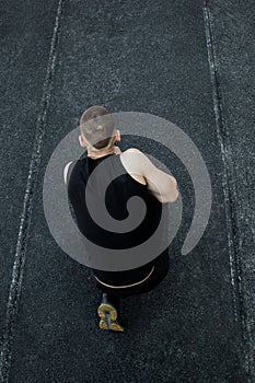 Caucasian man preparing for the start of the sprint. stadium, rubber track. athletics competitions. Track and field runner in