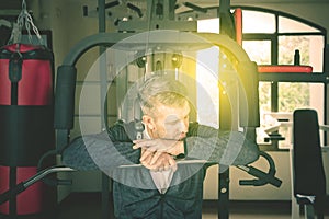 Caucasian man resting on the exercise machine