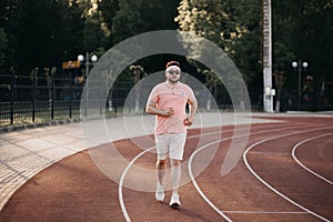 Caucasian man running in the urban city with copy space. Fitness, workout, sport, lifestyle concept.