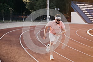 Caucasian man running in the urban city with copy space. Fitness, workout, sport, lifestyle concept.