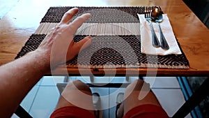 Caucasian man sitting in cafe and waiting for lunch or dinner.