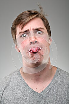 Caucasian Man Sticking Tongue Out Portrtait