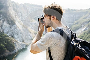 Caucasian man taking photo on an adventure