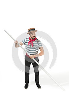 Caucasian man in traditional gondolier costume and hat