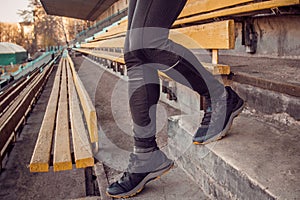 Caucasian man trains in running on the stairs. Track and field runner in sport uniform training outdoor. athlete, top view. step