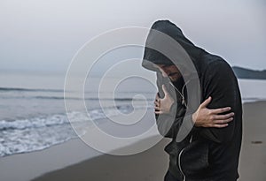 Caucasian man walking alone at the beach photo