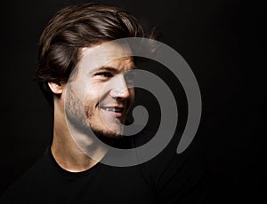 Caucasian man wearing black tshirt and trendy hairstyle