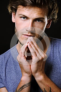 Caucasian man wearing black tshirt and trendy hairstyle