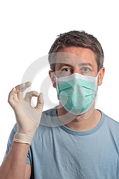 Caucasian man wearing a protection mask and making vistory sign with protective gloves on a white background