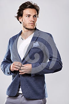 Caucasian man wearing white shirt and trendy hairstyle