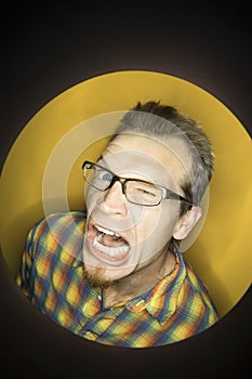 Caucasian man winking.