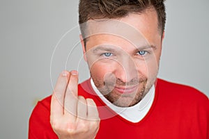 Caucasian mature guy showing gesture price how much money or how much it cost.