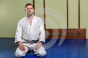 Caucasian men are practicing aikido on the tatami