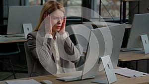 Caucasian middle-aged adult female corporate office worker with computer feel stress frustration work on desktop