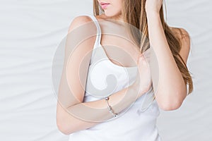 Caucasian model with brown hair in white singlet. closeup portrait noface only lips