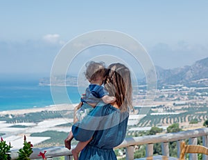 Caucasian mother with a child have a vacation on Crete