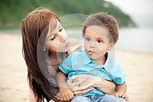 Multi-Ethnic family relaxing together outdoors