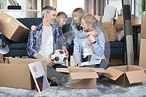 Caucasian parents and two kids enjoying moving day