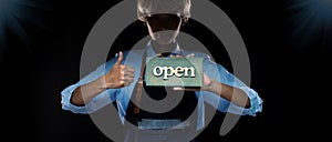 Caucasian person hold Open Sign Business to show service at door entrance store, cafe, retail and welcome shop. Happy Entrepreneur