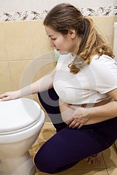 Caucasian pregnant woman with morning sickness
