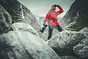 Caucasian Professional Nature Photographer with Digital Camera Preparing For the Shot