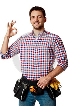 Caucasian repairman worker wearing tool belt