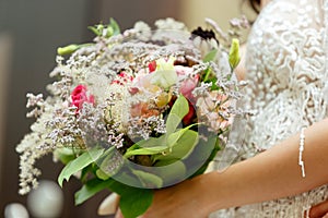 Caucasian romantic young bride celebrating his marriage in city