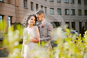 Caucasian romantic young couple celebrating their marriage in city