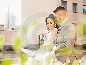 Caucasian romantic young couple celebrating their marriage in city