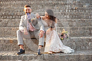 Caucasian romantic young couple celebrating their marriage in city