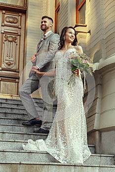Caucasian romantic young couple celebrating their marriage in city